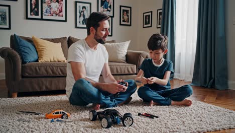 father and son building a remote control car together