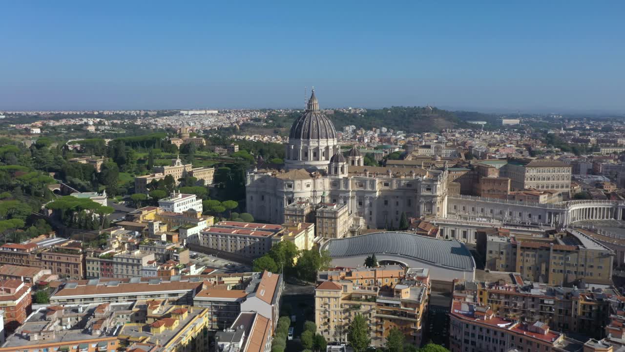 Aerial drone rising above St. Peter’s Basilica, and revealing its majestic dome, and the vast Piazza San Pietro, symbolizing the heart of the Catholic Church and Rome’s timeless beauty