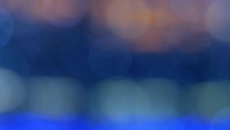 el fondo abstracto de la noche está desfocado con un bonito bokeh. luces de navidad borrosas bokeh. panorámica a través del borrón.