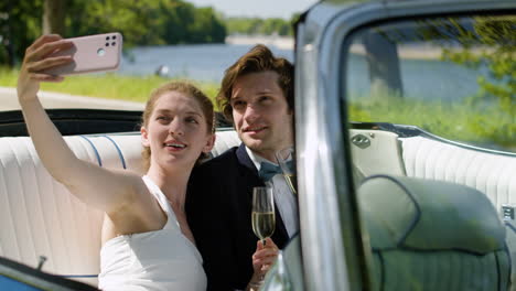 Just-married-couple-in-a-blue-convertible-car