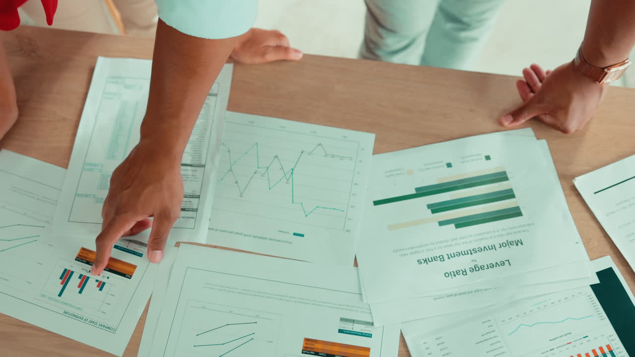 Investment, worker hands and documents on a desk