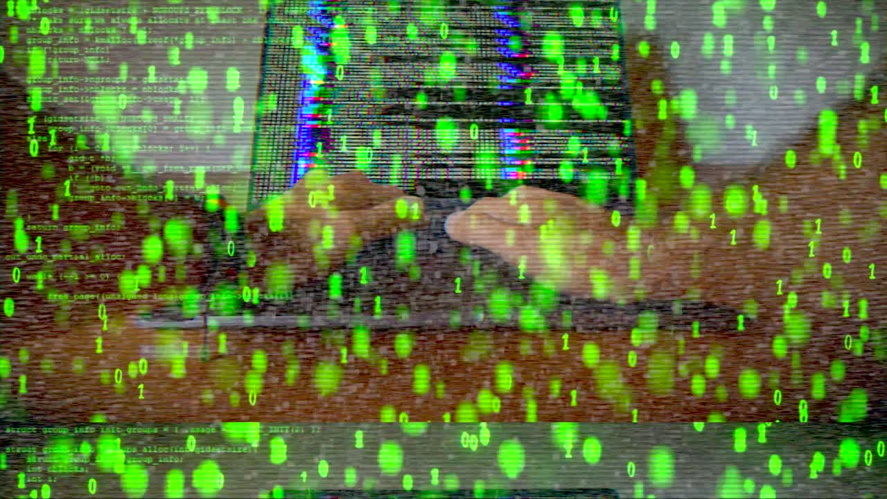 Laptop with green binary code overlay and digital glitch effect