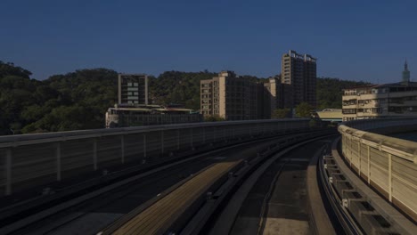 4k time lapse of monorail pass the city in taipei city in taiwan