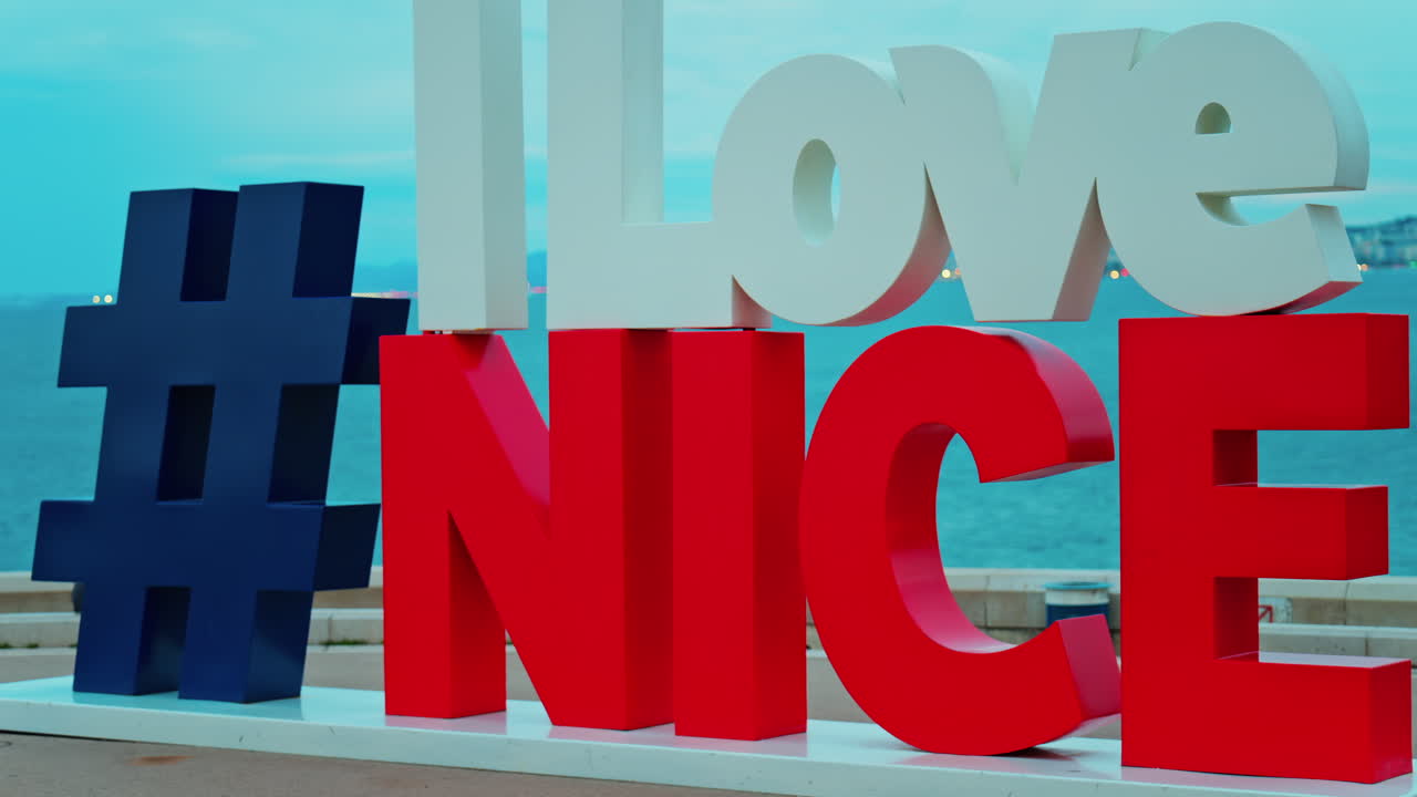 View of the I Love Nice sign on the promenade overlooking the sea in Nice, France