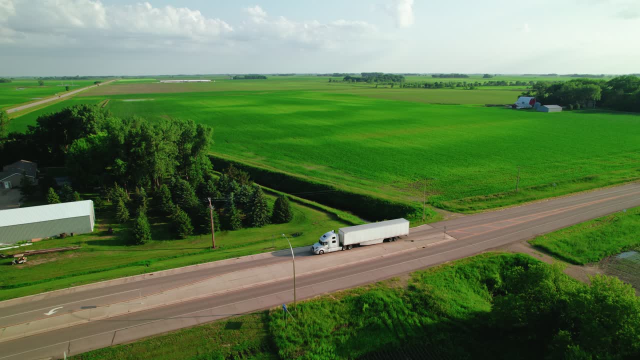 Drone view of Semi trucks on country road in wisconsin, USA