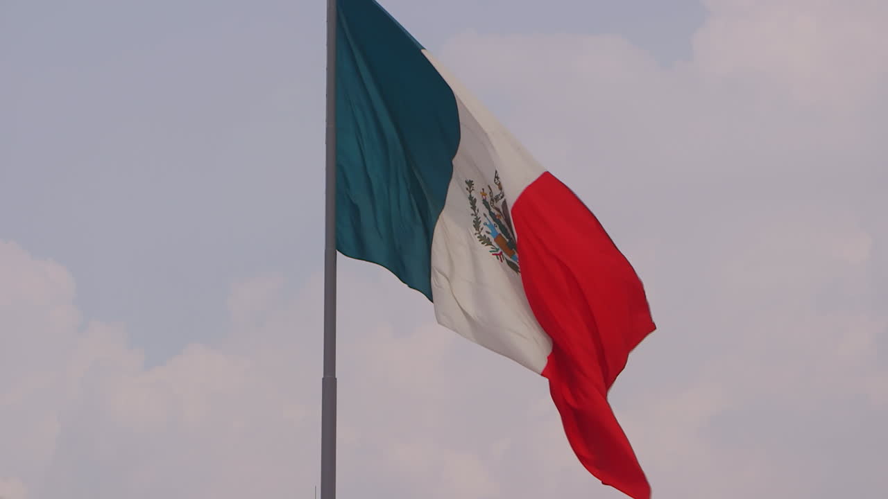 Mexican flag floating in the sky.