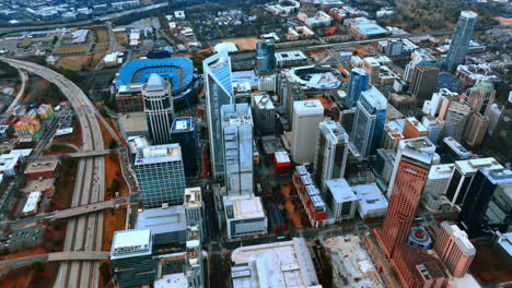 modern skyscrapers, highways, stadium in the city uptown. aerial view on charlotte, nc, usa