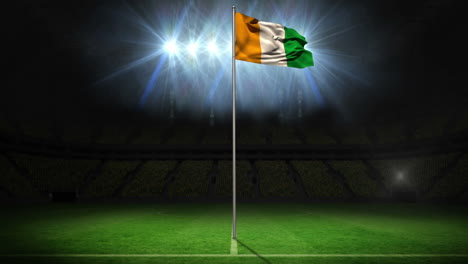 ivory coast national flag waving on flagpole