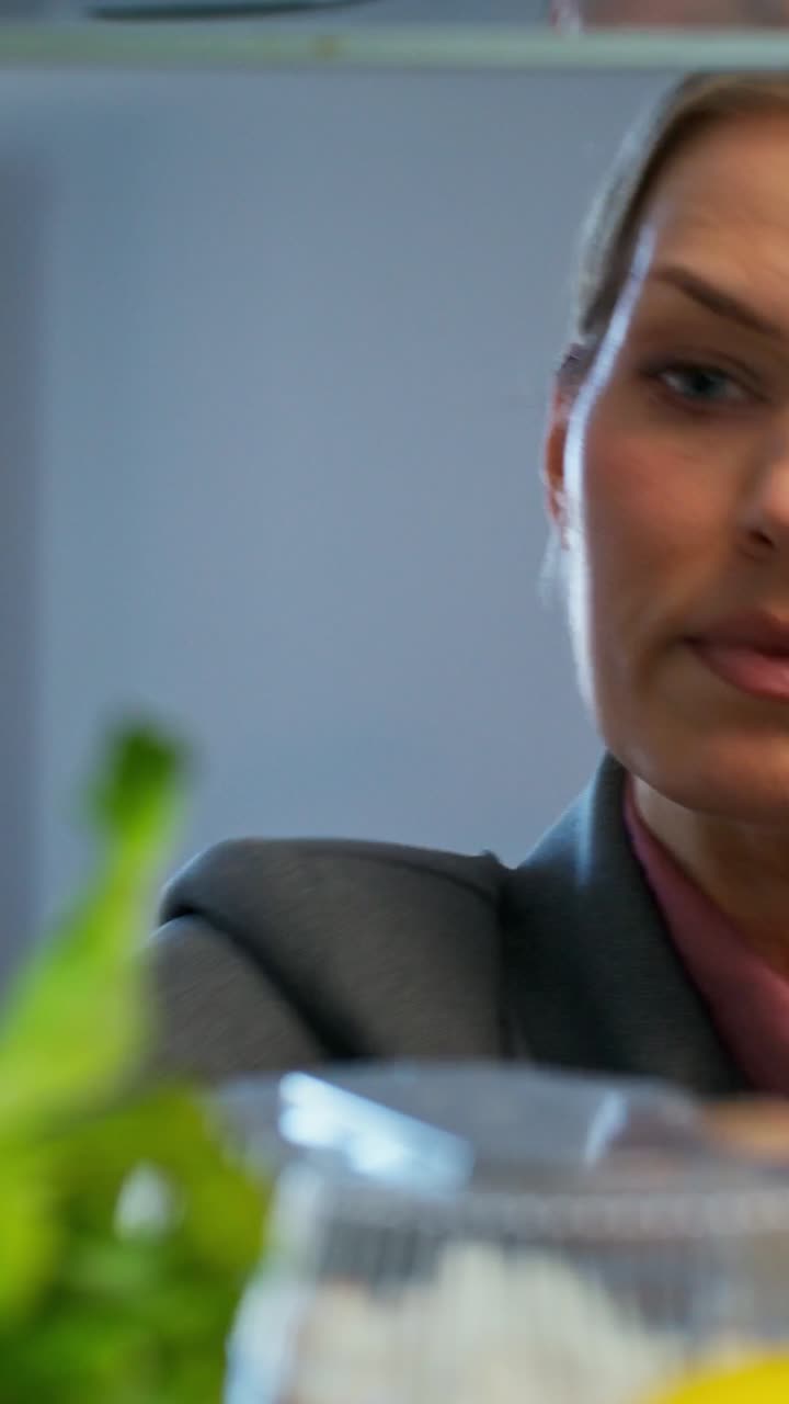 Person getting celery from the refrigerator
