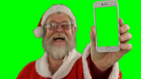 Weihnachtsmann-Zeigt-Mobiltelefon