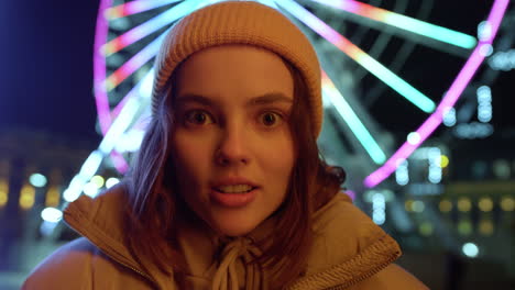 Surprised-woman-enjoying-night-on-urban-street.-Amazed-girl-looking-camera.