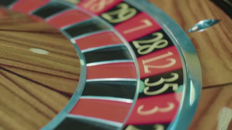 casino roulette wheel with white ball on black sector ten. gambling concept