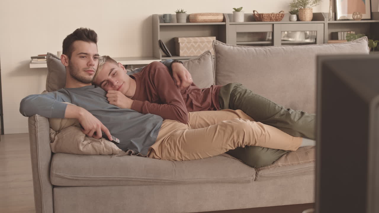 Couple Resting at Home and Watching TV
