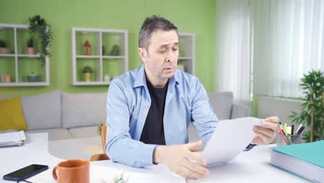 the guy working on the paperwork is bored.