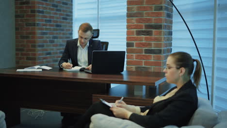 business partners planning work. businessman and businesswoman meeting in modern office