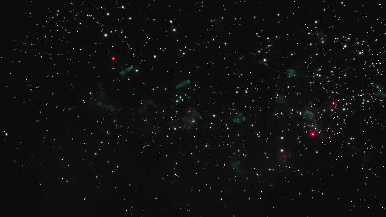 Stunning fireworks bursting brightly in clear dark night sky
