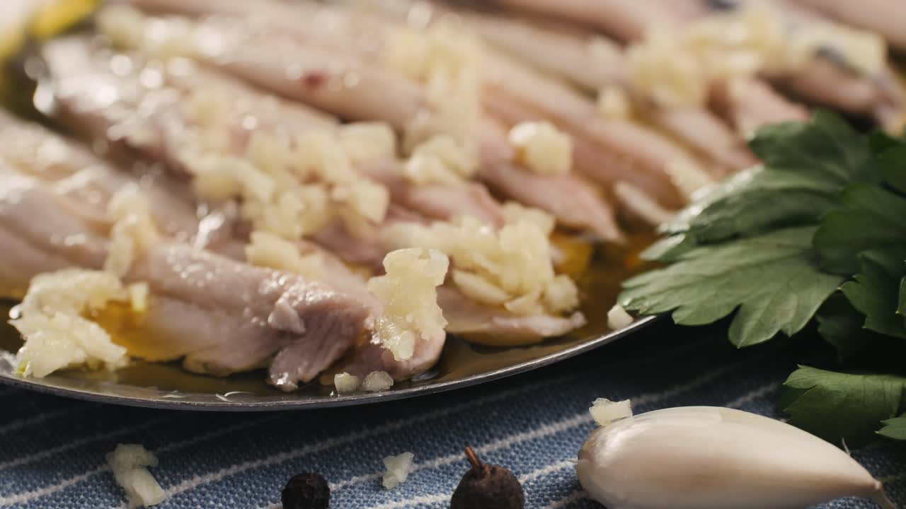Fresh Sea sardines and Anchovy Fish and Mullus On Display On Ice On Market Store Shop. Seafood Fish Background, close up stand of small salty white fish.