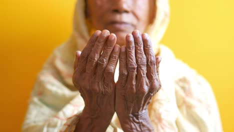 elderly woman in prayer