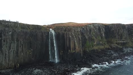 Dolly-revealing-cliff-waterfall-|-Drone