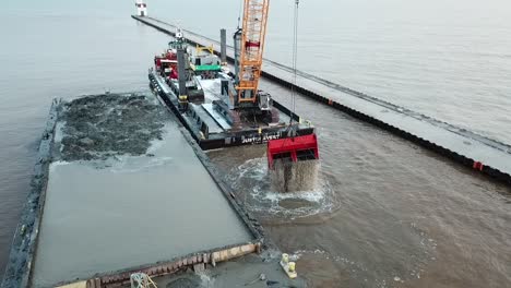 dredging operation in kewaunee harbor on lake michigan, kewaunee, wisconsin-9