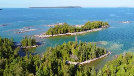 panoramic aerial view of georgian bay revealing a turquoise lake, rugged coastline and forests in ontario, canada