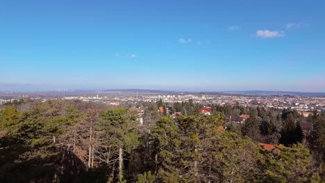 city of sopron from the sorhazdombi lookout with the surrounding forests and nature on a sunny day in hungary.