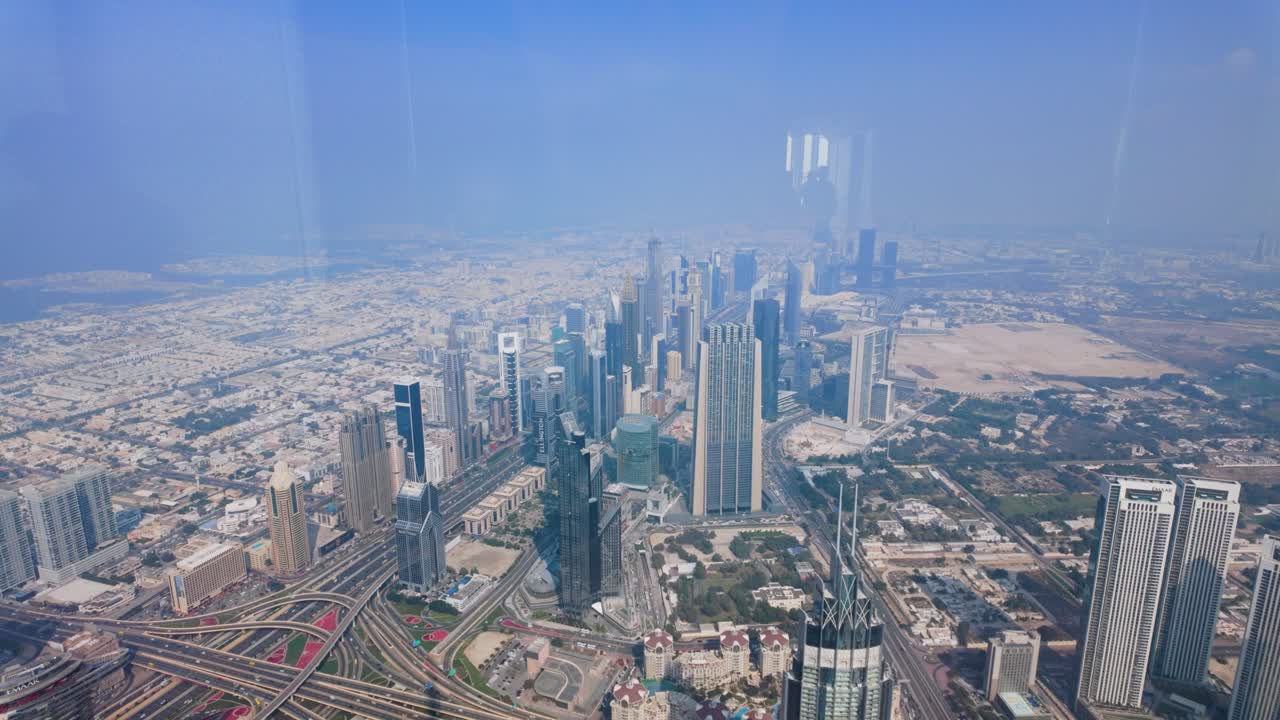 Looking out the window of the Burj Khalifa skyscraper in Dubai, United Arab Emirates which is the world's tallest structure