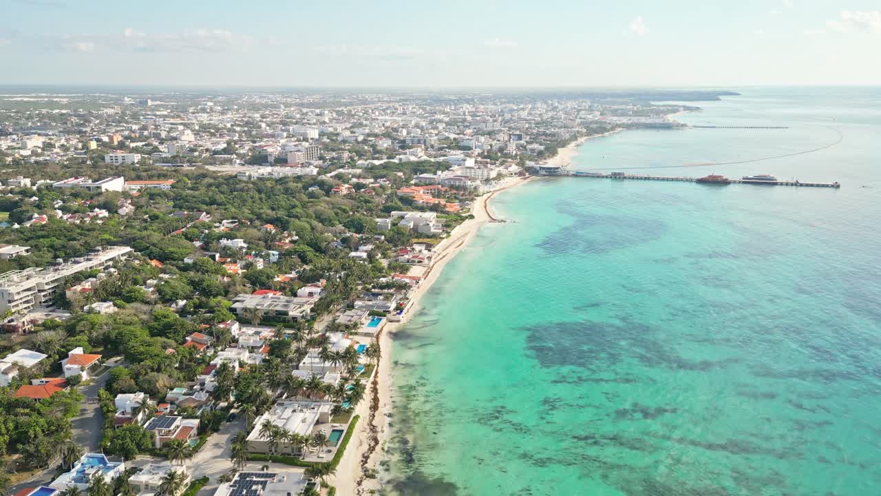 Playa del carmen coastline with turquoise sea and sunny skies, aerial view