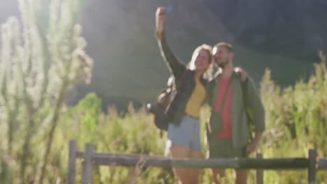 Caucasian-couple-taking-a-selfie-in-nature