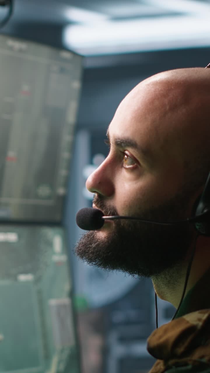 Vertical video Army telecommunication systems operator using radio and satellite equipment