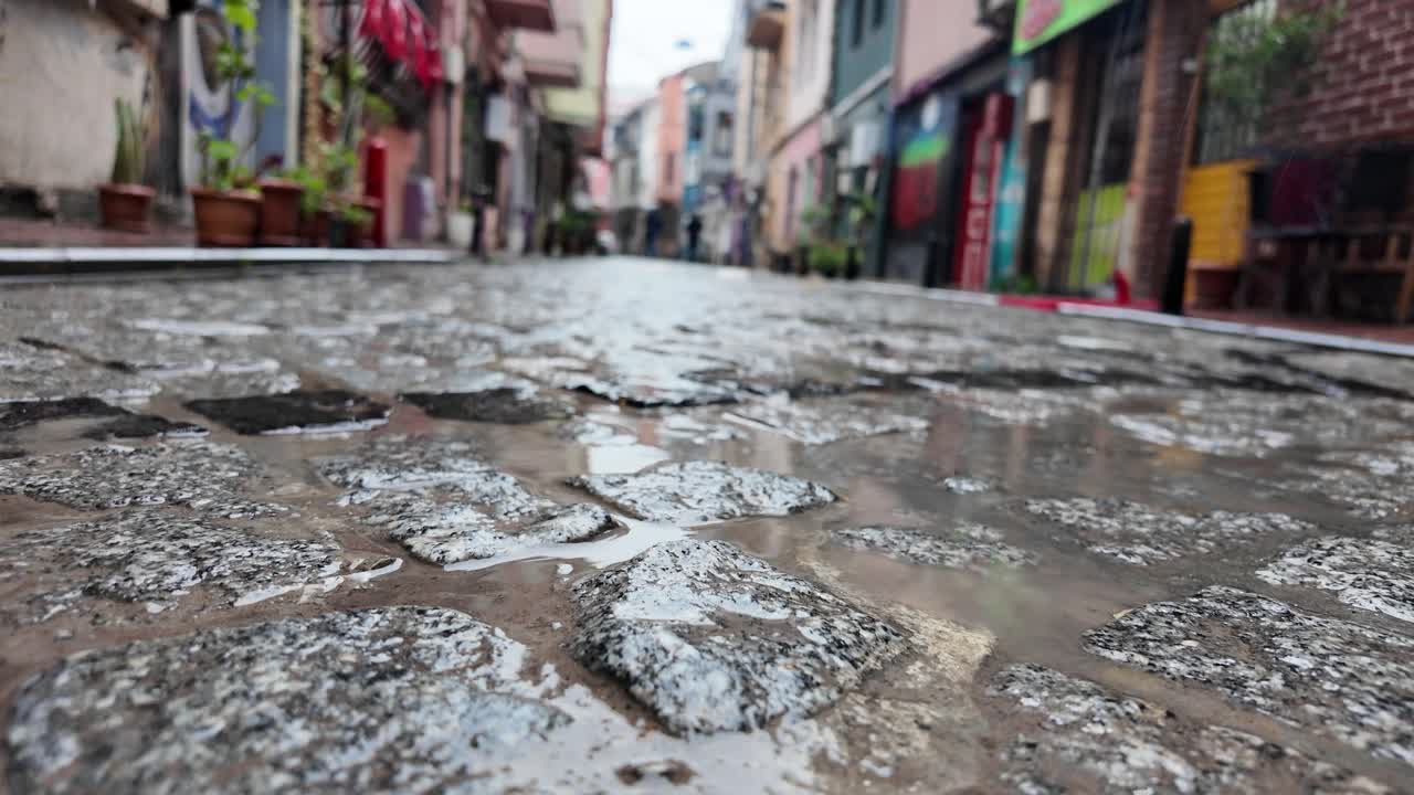 Wet Cobblestone Street Scene in European Town