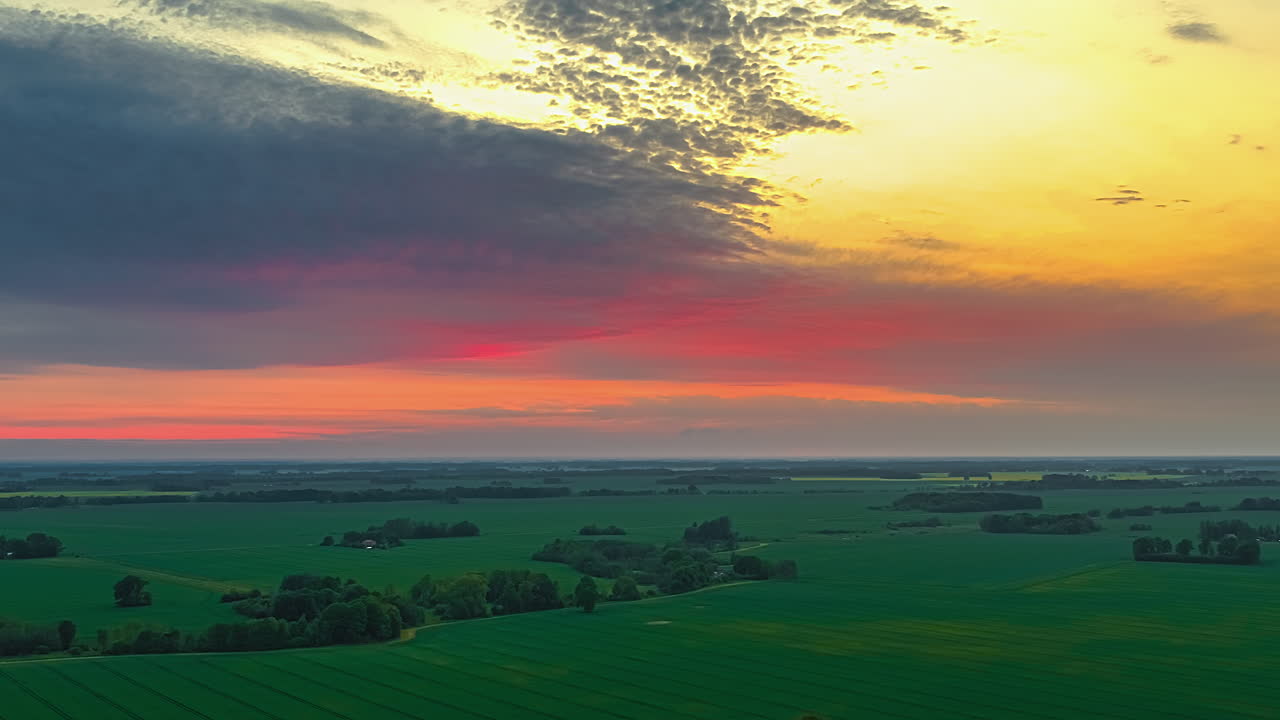 Sunset Sky Over Sweeping Verdant Farmlands. Timelapse