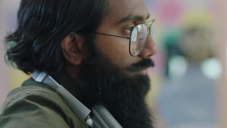 diverse-business-people-working-using-computer-technology-indian-businessman-networking-browsing-online-project-in-colorful-startup-office-wearing-glasses-close-up