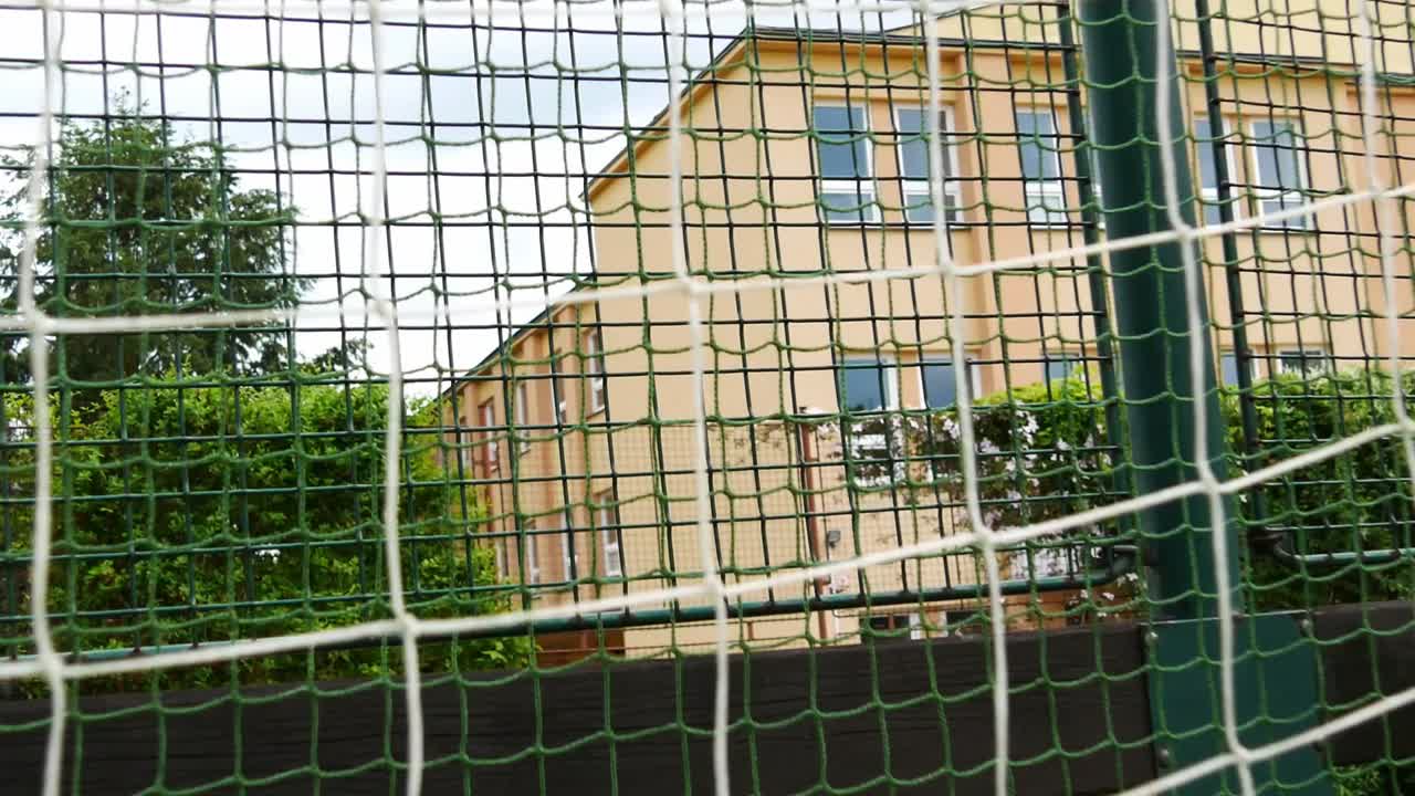 Detail on artificial football lawn and football gate