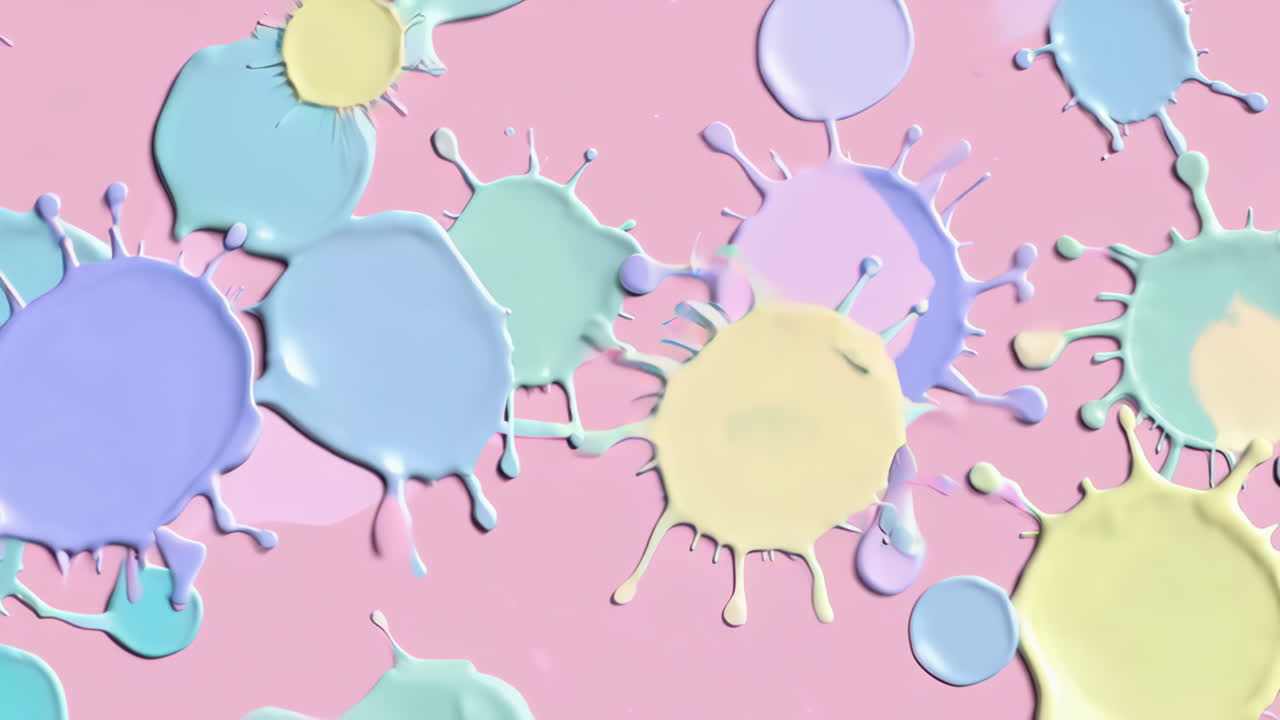 Abstract Pastel Paint Splatters on a Pink Background