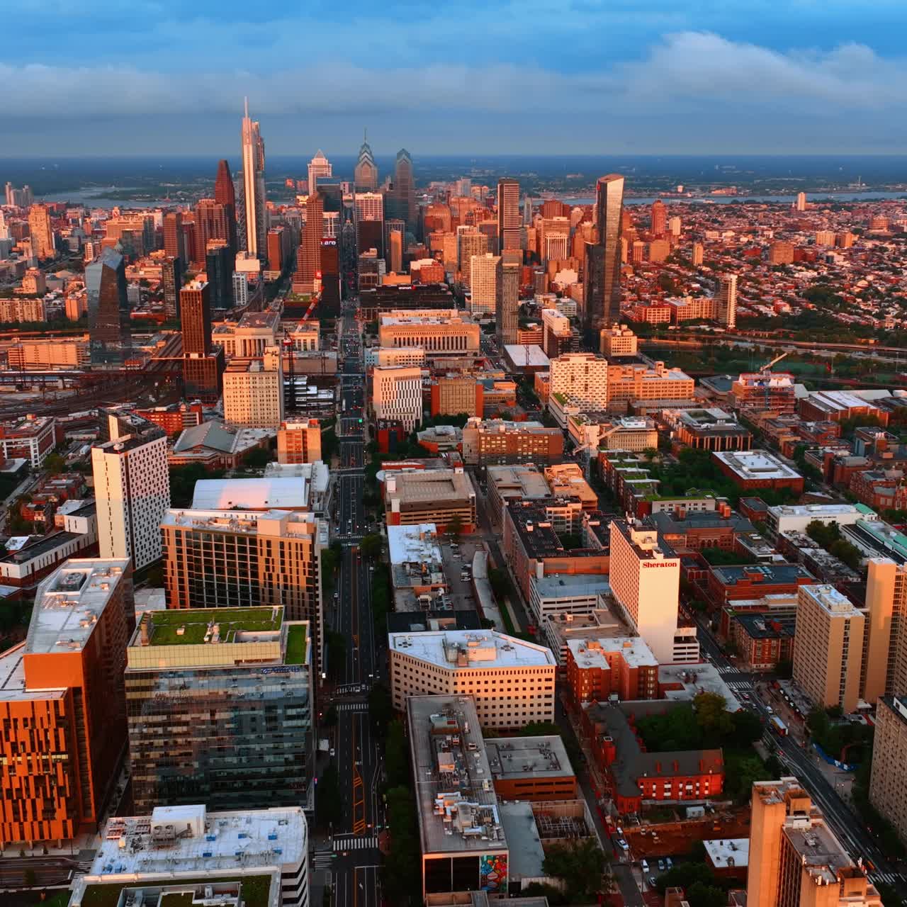 Philadelphia downtown at golden hour. Drone footage of the city architecture in the setting sun light