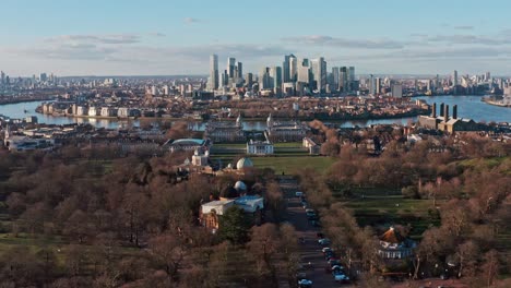 dolly forward aerial drone shot of greenwich observatory university towards canary wharf skyscrapers