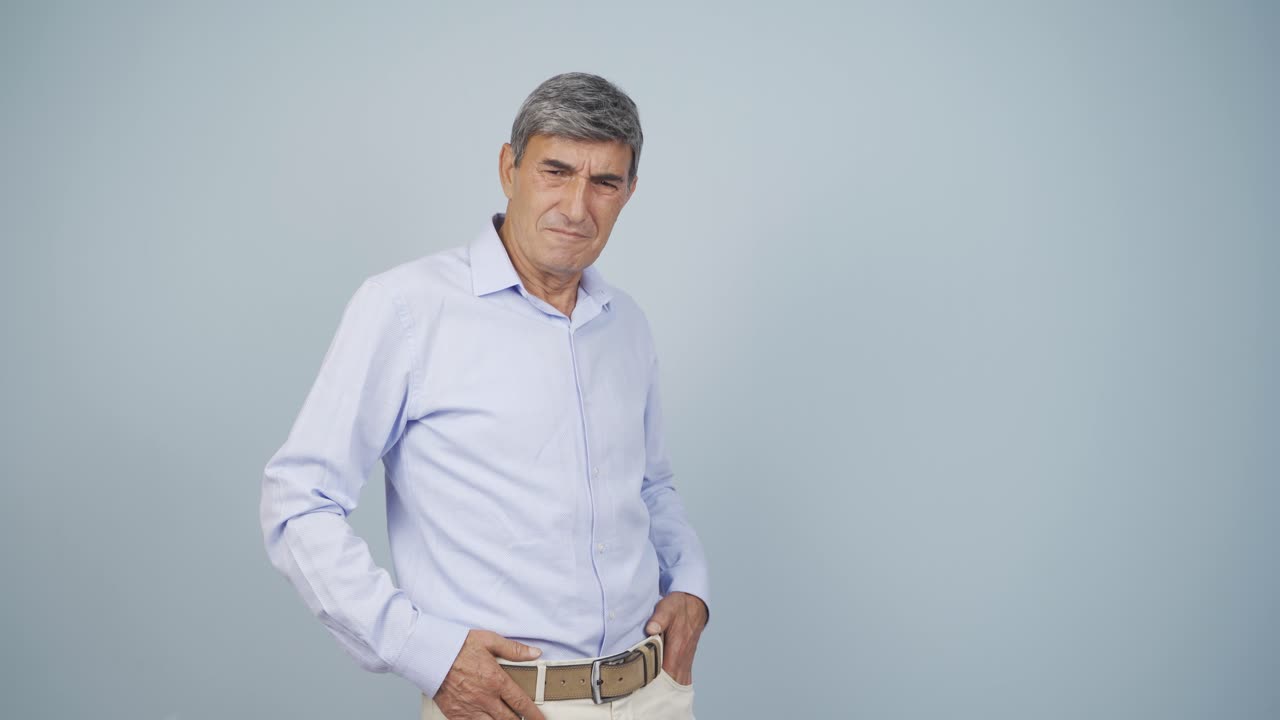 The old man is disgusted.