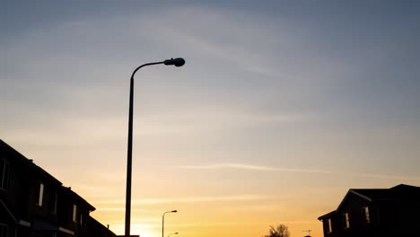 streetlights at sunset over residential area