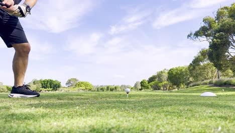 golfer executing a swing on a sunny day