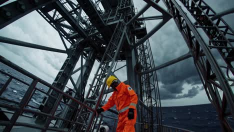 oil rig worker on a stormy day