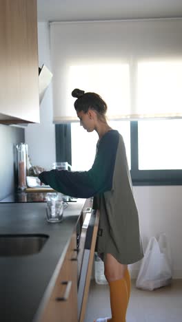 woman cooking in a modern kitchen