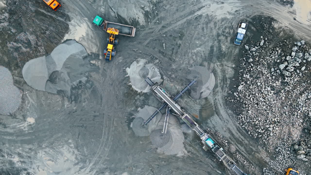 Heavy machinery at site. Heavy equipment moves materials on a construction site during the day