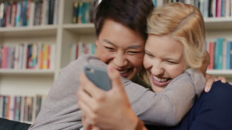 Friends-at-home-having-fun-laughing-using-smart-phone