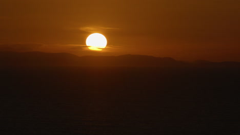 golden sunset timelapse over scottish landscape with mountains and sea in view