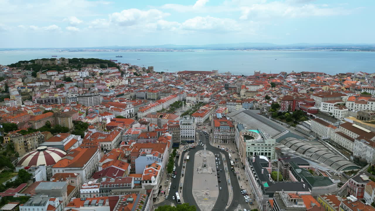 Aerial view over the Rossio square, toward Tagus river, summer day in Lisbon