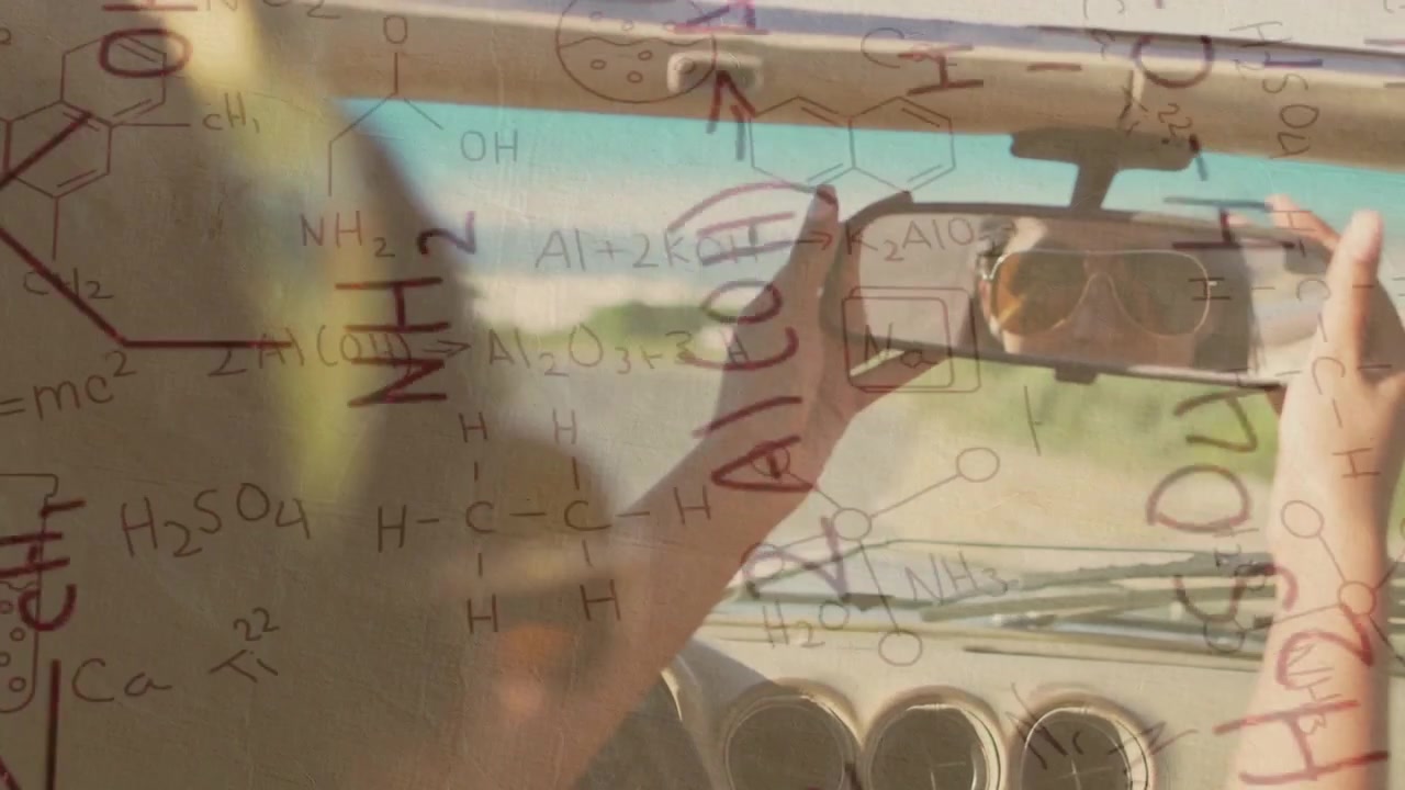 Woman Adjusting Rearview Mirror in Car with Chemical Formulas Overlay