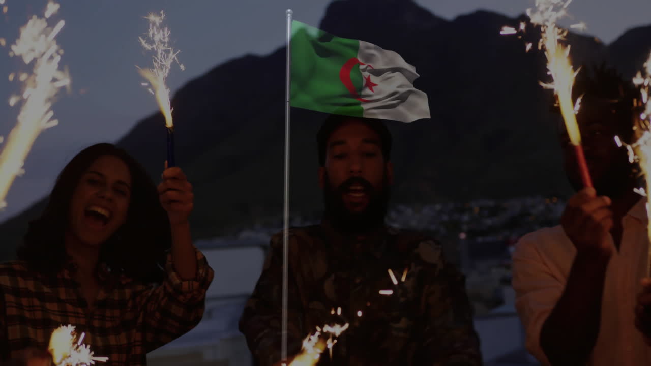Celebrating with sparklers and Algerian flag, people enjoying animation in mountains