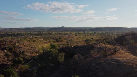 Flying-over-the-Malawi-sabana,-in-Monkey-beach,-Malawi,-Africa