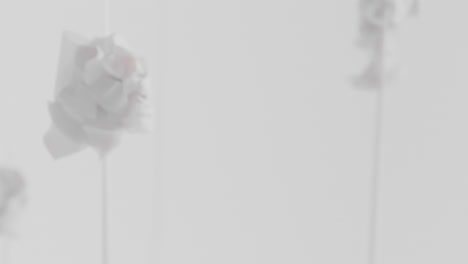 crushed android heads on spikes in white space